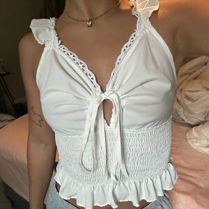 Brand is shein color is white floral top with lace